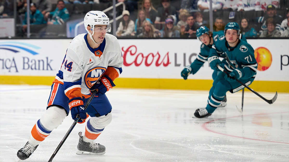 New York Islanders center Jean-Gabriel Pageau (44) controls the puck against San Jose Sharks center Macklin Celebrini (71) and defenseman Henry Thrun (3) during the first period at SAP Center at San Jose.